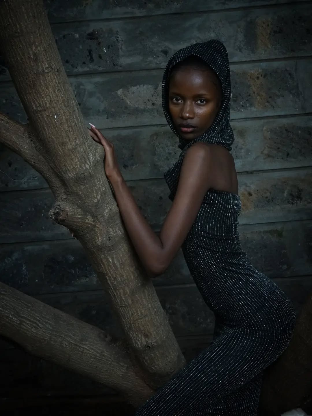 Claire Raina in a pinstripe hooded dress, from her Instagram @claireraina1