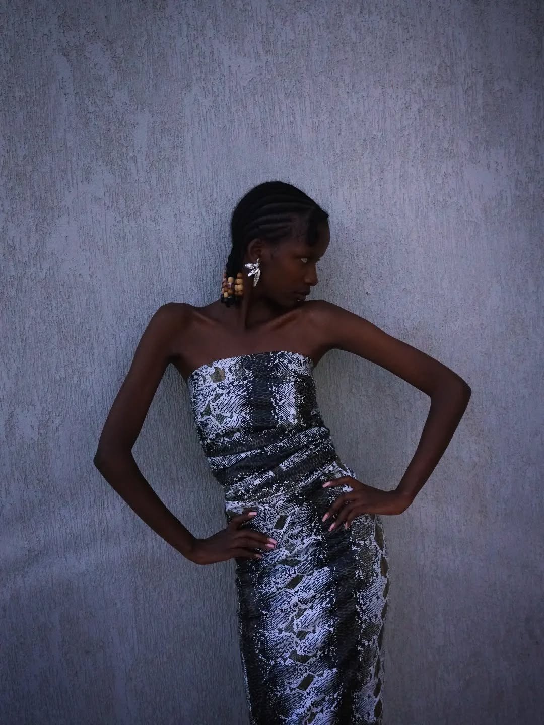Claire Raina in a snake-print strapless dress, from her Instagram @claireraina1